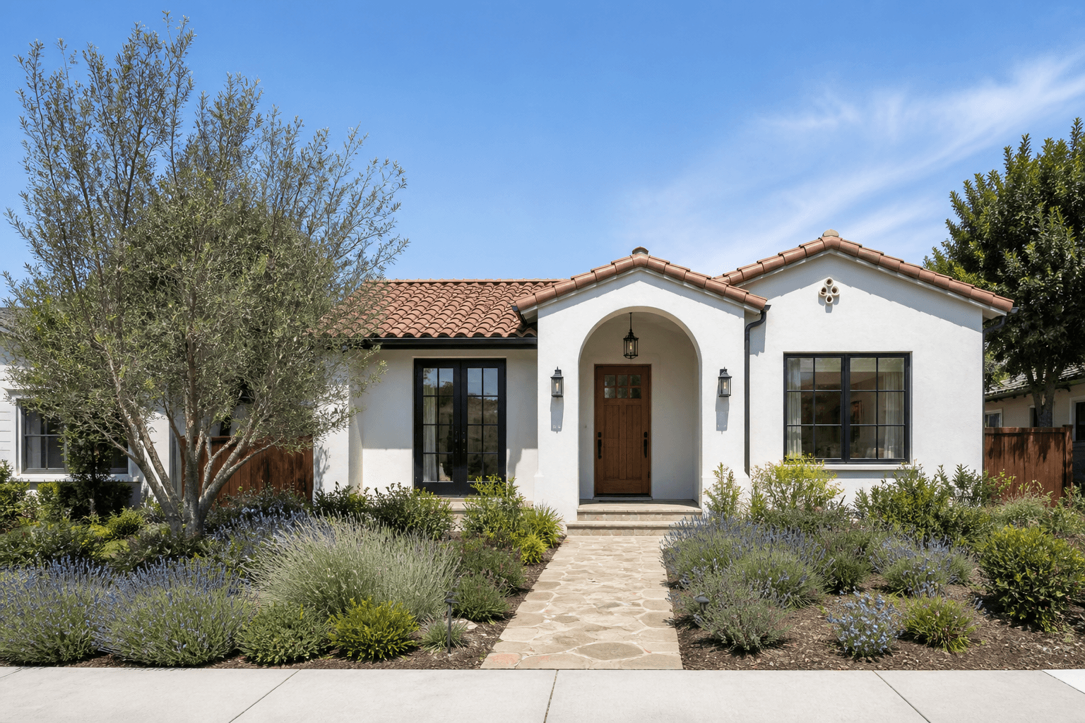 Warm white San Jose bungalow with a tile roof and landscaped front path